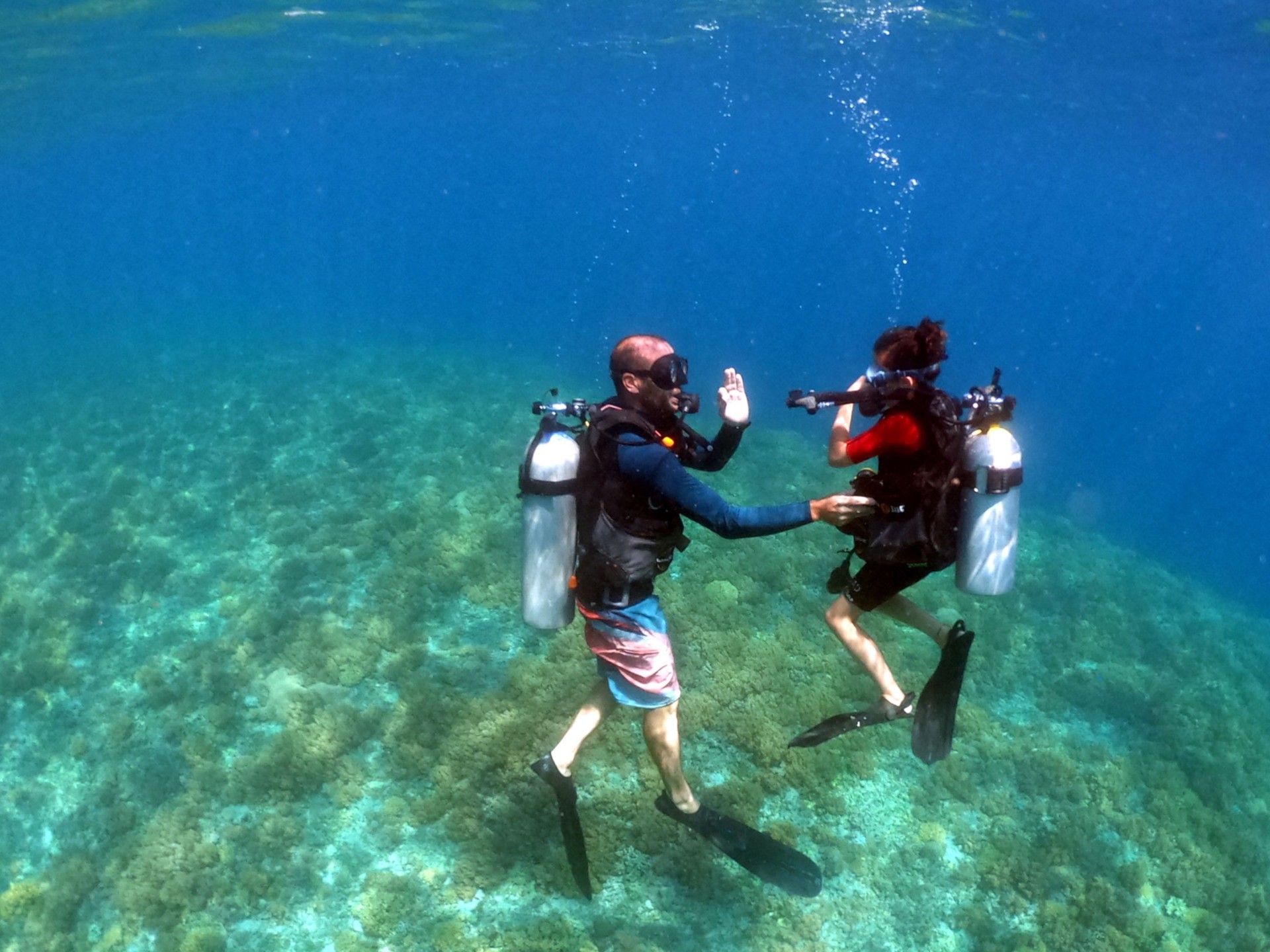 Child girl doing scuba dive course